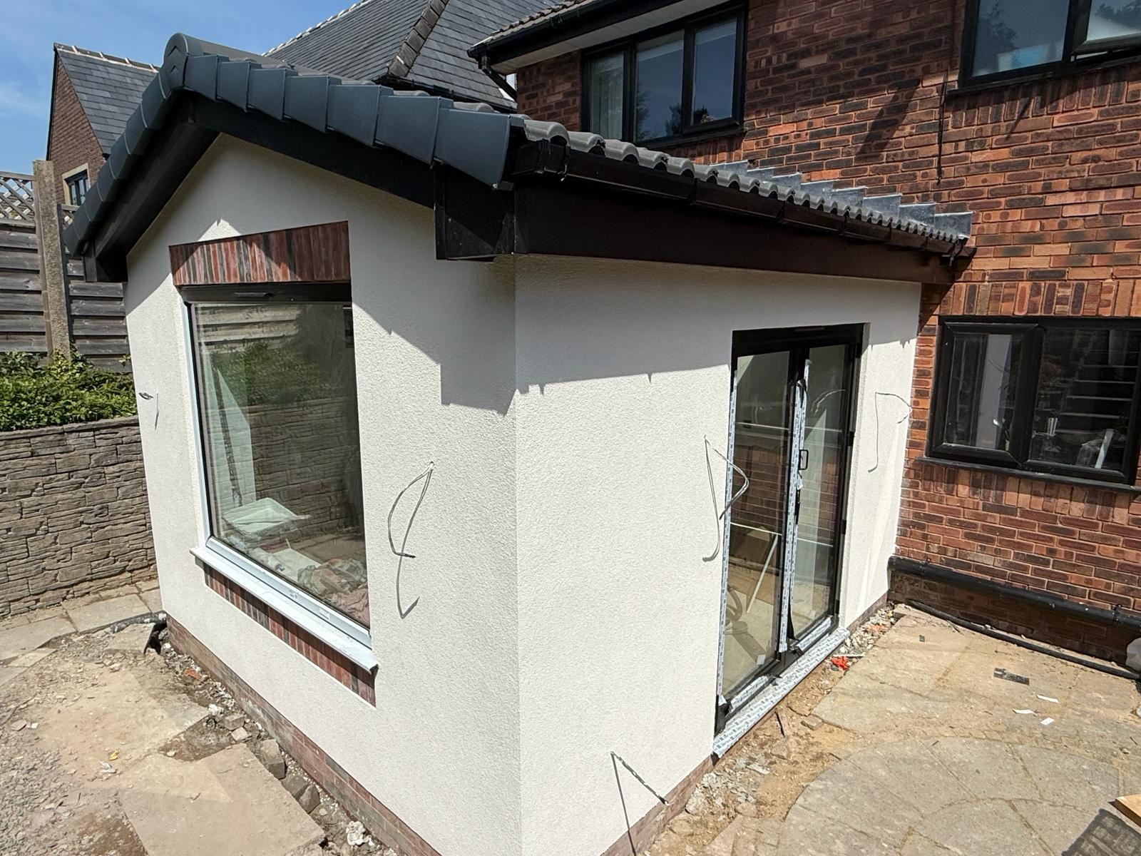 Interior strip-out with full bonding coat applied wall-to-wall, ready for finish skim