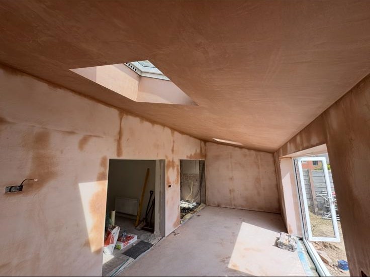 Bedroom skimmed in fresh plaster — straight lines, sharp internal corners